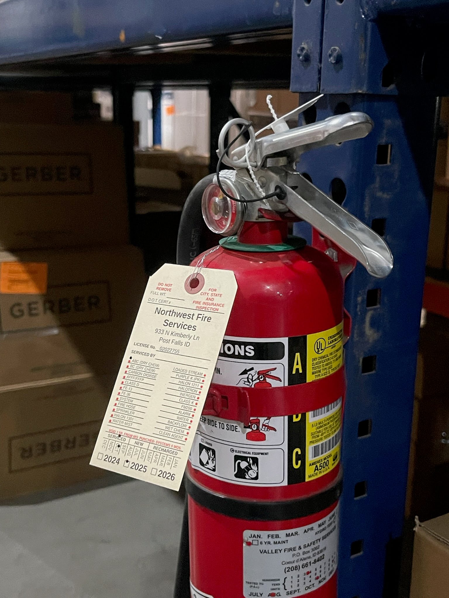 Fire Extinguisher with NW Fire Services Tag